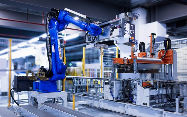 Industrial robotic arm automating production processes in a manufacturing facility.